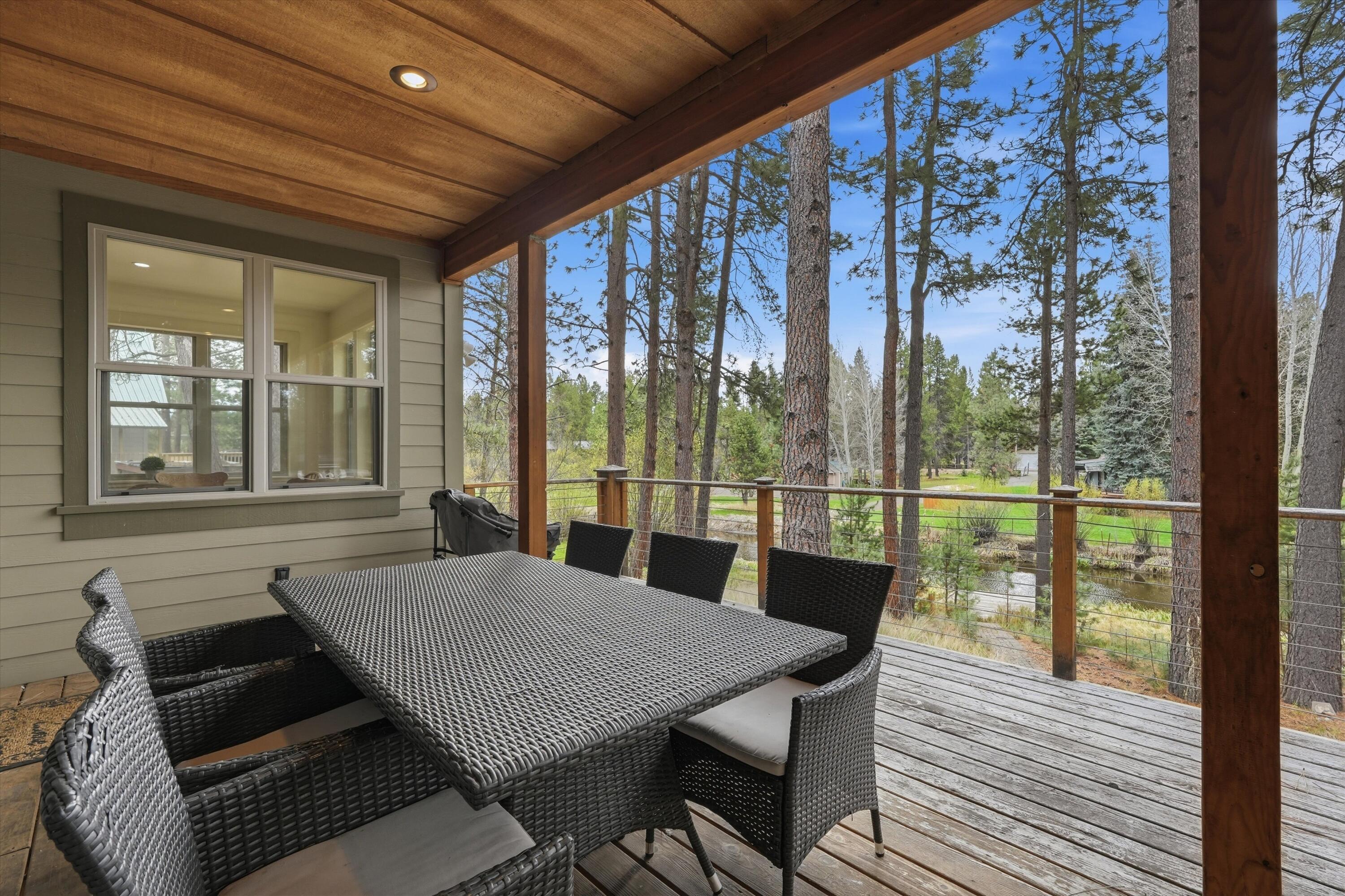 17179 Island Loop Way Bend, OR 97707 - Photo 36 of 52 a view of a dining room with furniture window and wooden floor