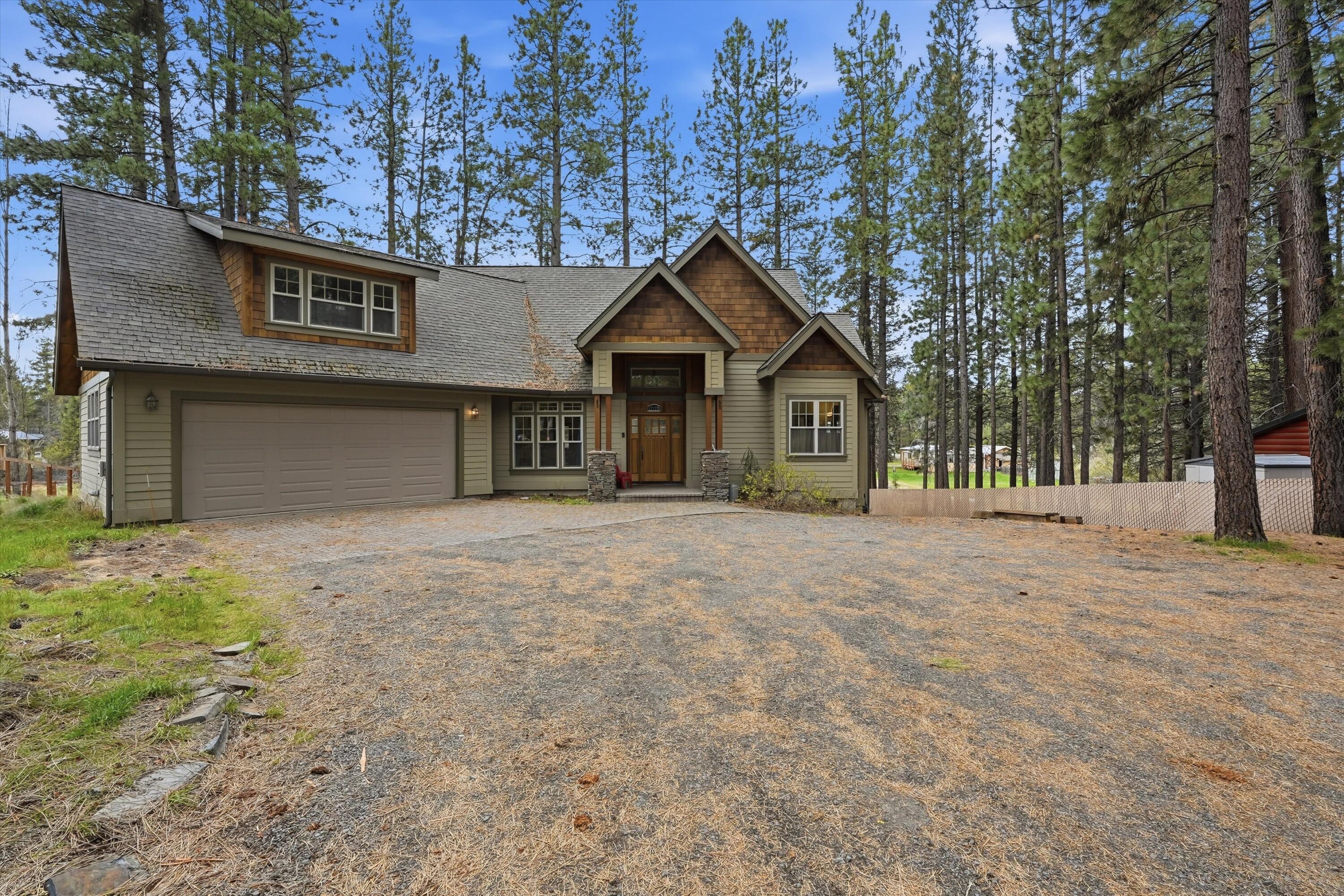 17179 Island Loop Way Bend, OR 97707 - Photo 2 of 52 a house with trees in the background