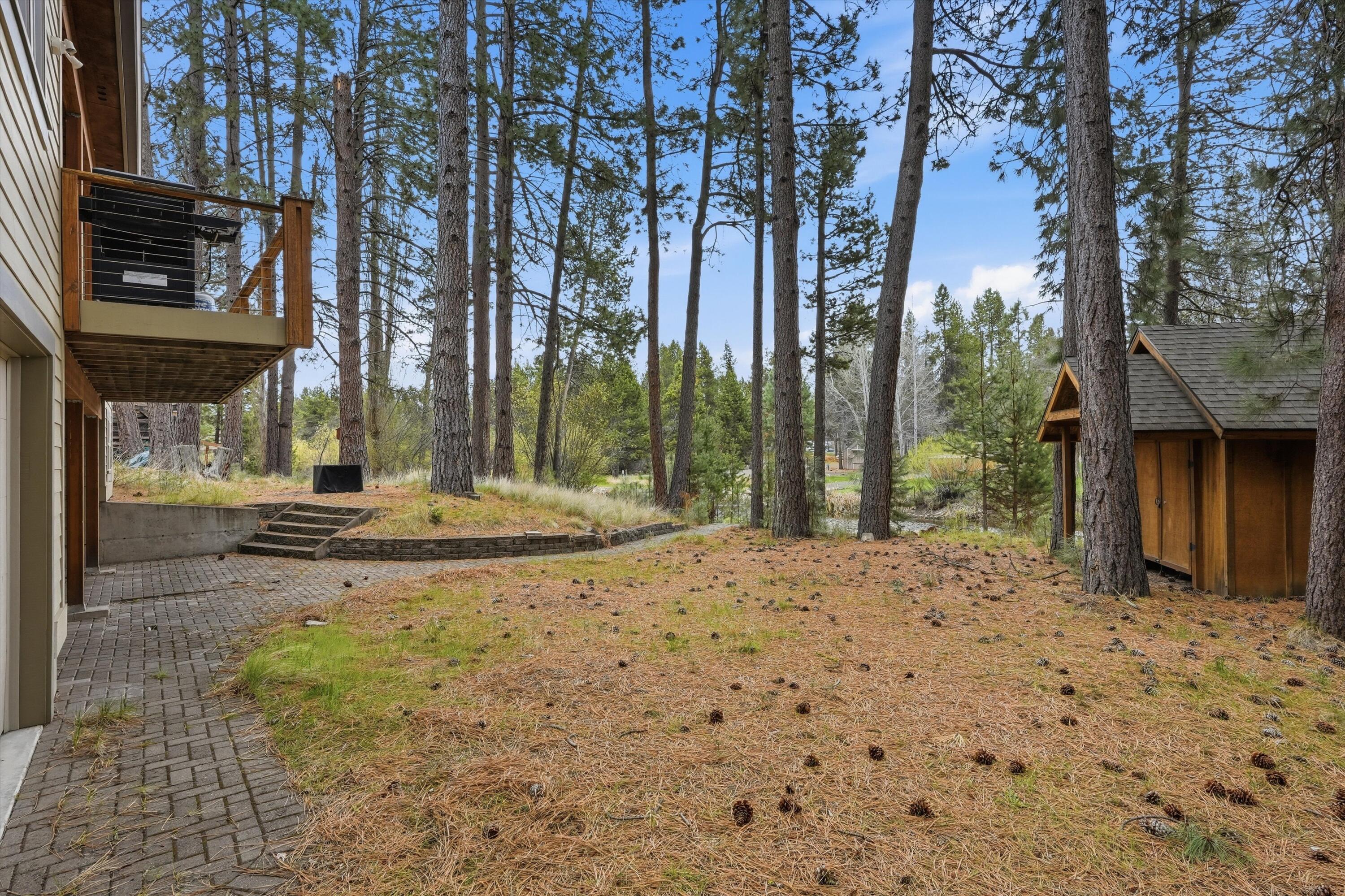 17179 Island Loop Way Bend, OR 97707 - Photo 38 of 52 a view of a house with a yard and tree s
