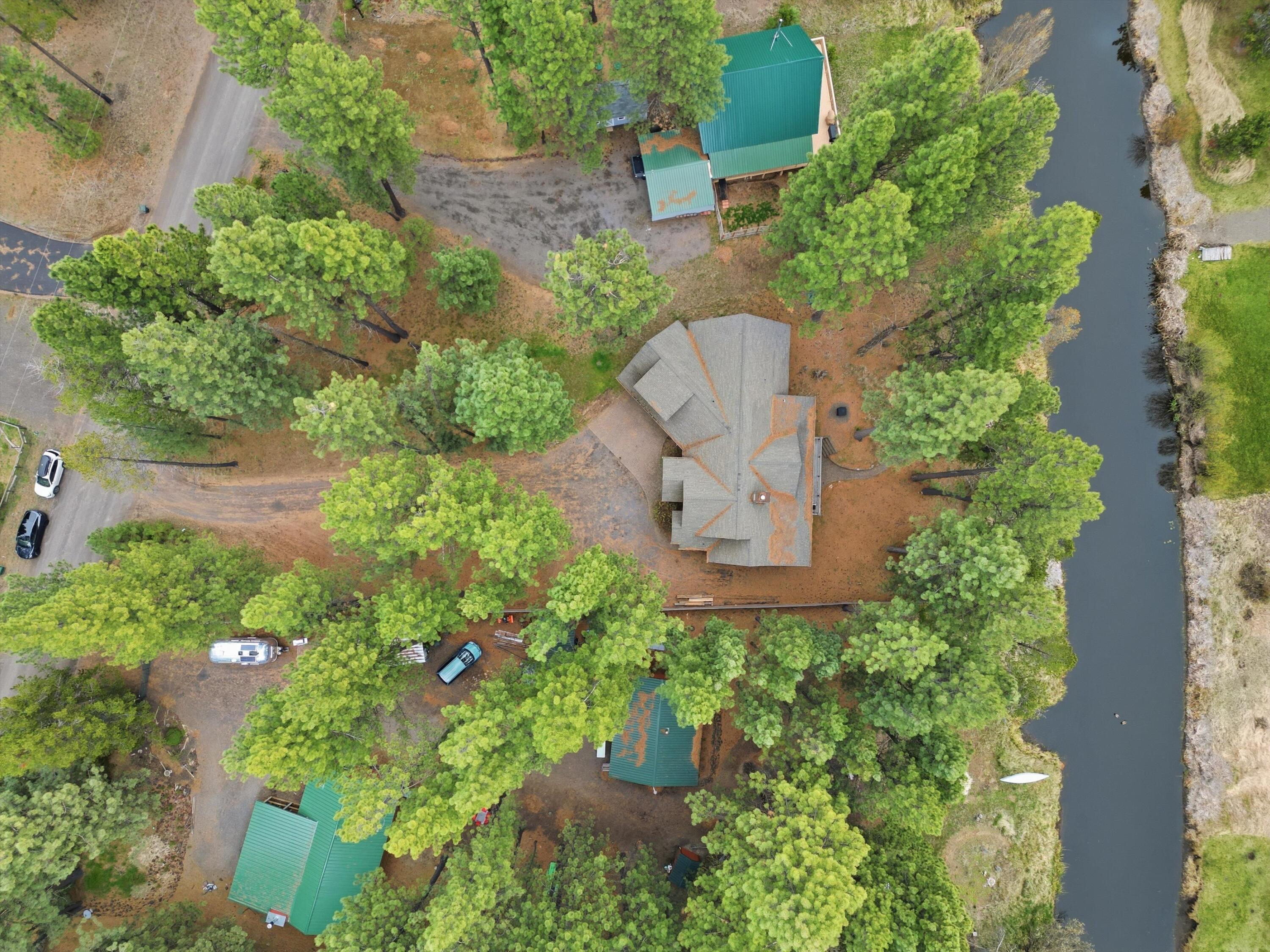 17179 Island Loop Way Bend, OR 97707 - Photo 45 of 52 an aerial view of a house with a yard and outdoor seating