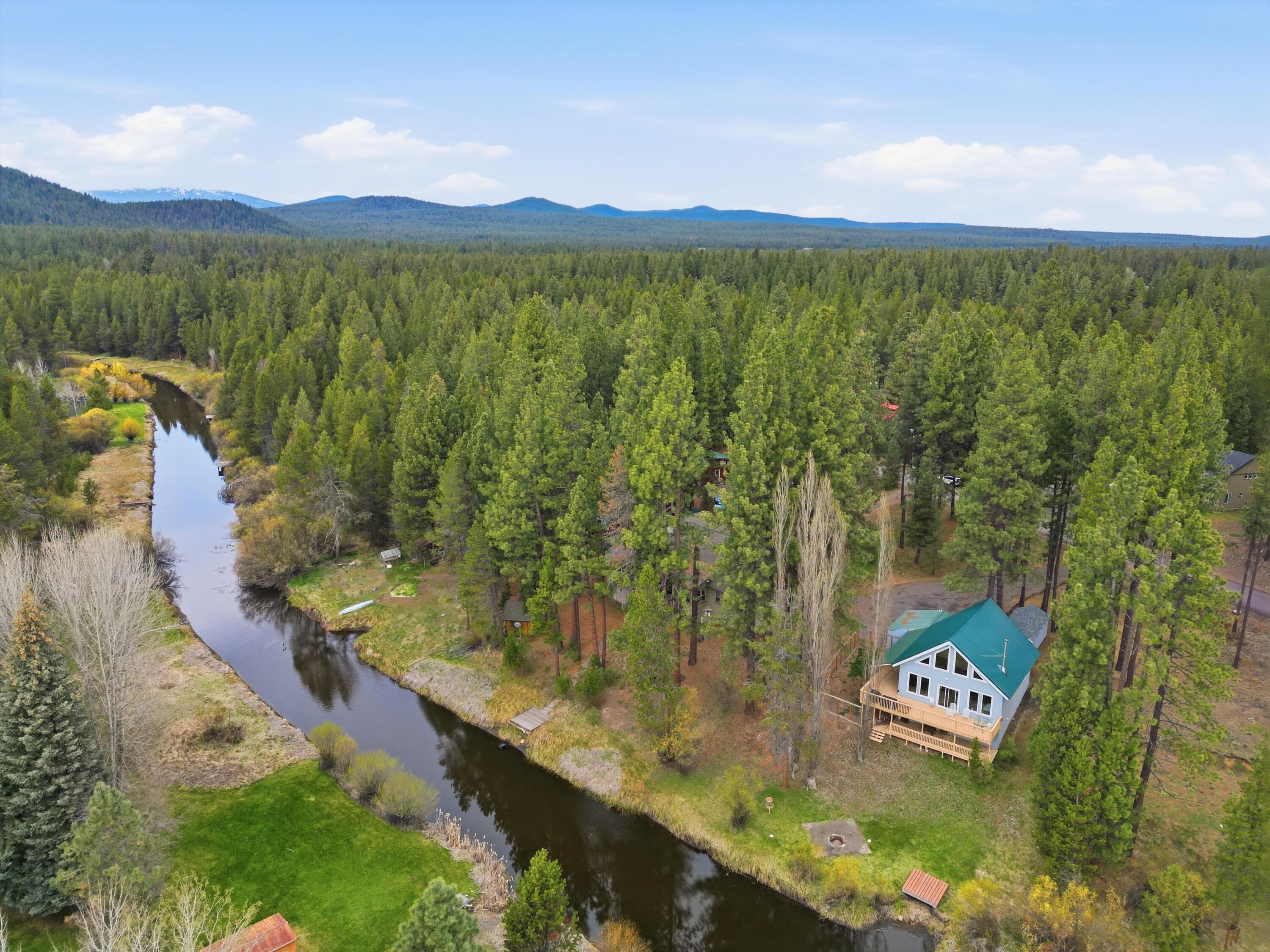 17179 Island Loop Way Bend, OR 97707 - Photo 47 of 52 a view of a lake with a mountain in the back