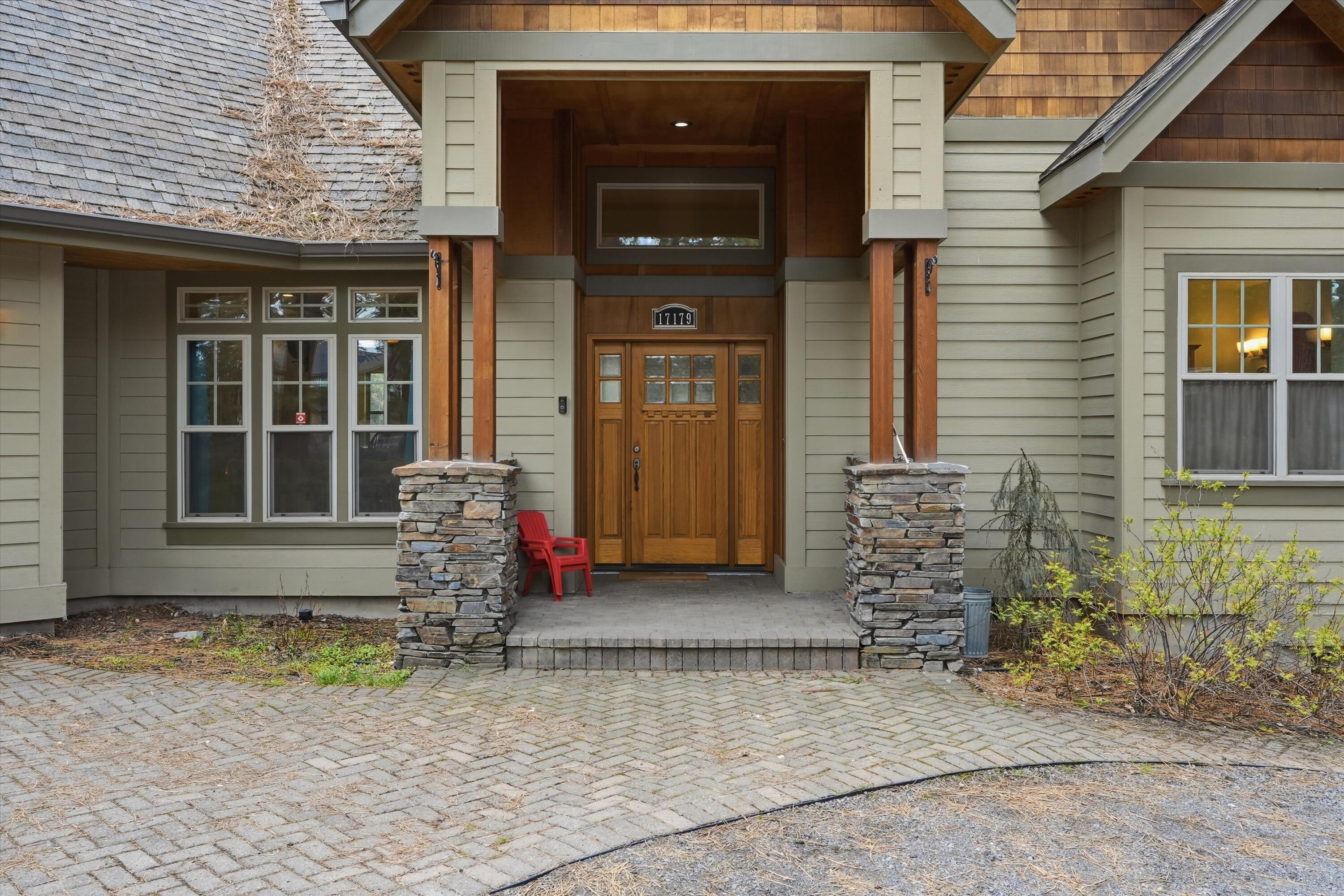 17179 Island Loop Way Bend, OR 97707 - Photo 3 of 52 a front view of a house with a yard