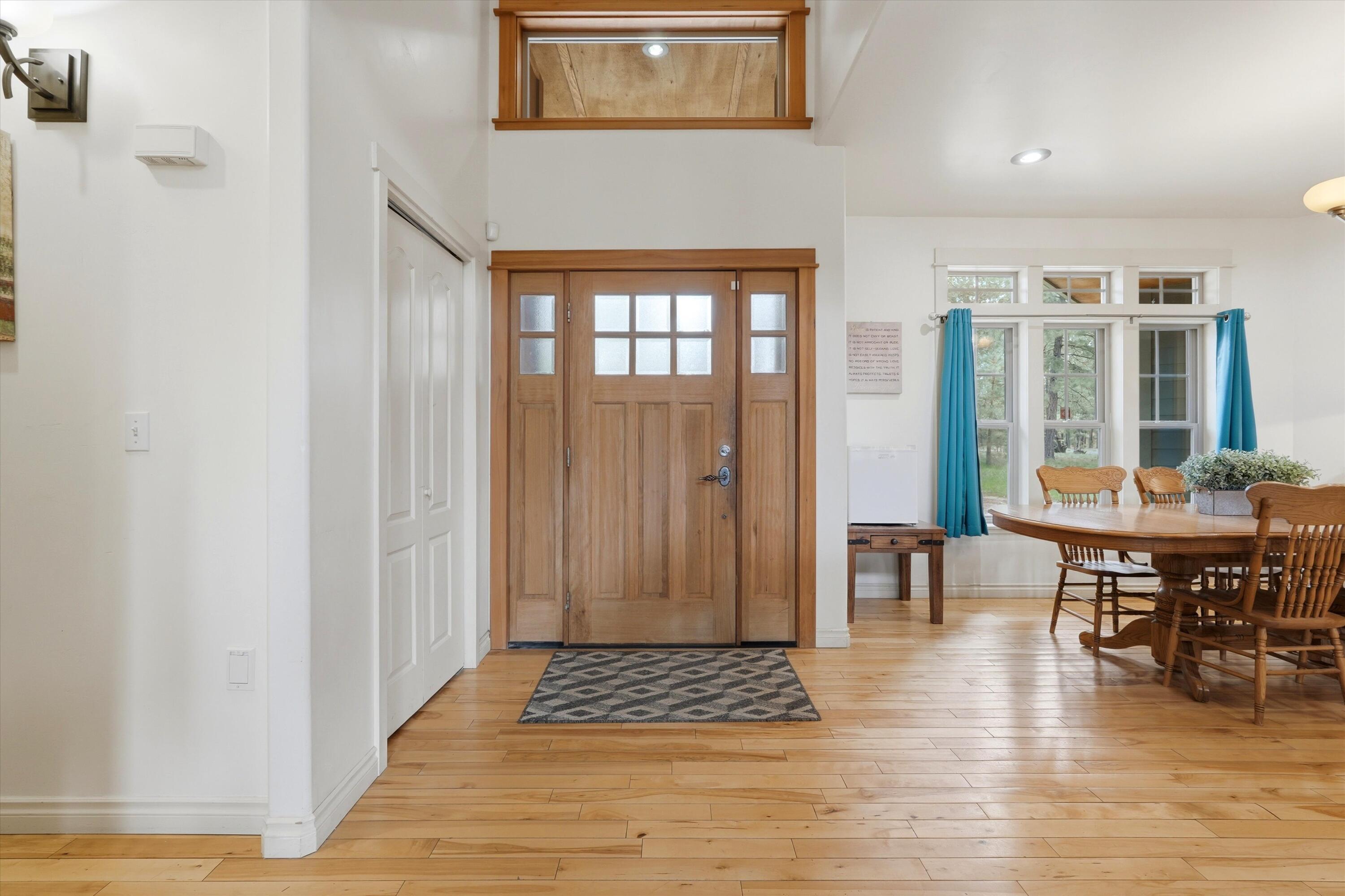 17179 Island Loop Way Bend, OR 97707 - Photo 5 of 52 a view of dining room with wooden floor and furniture