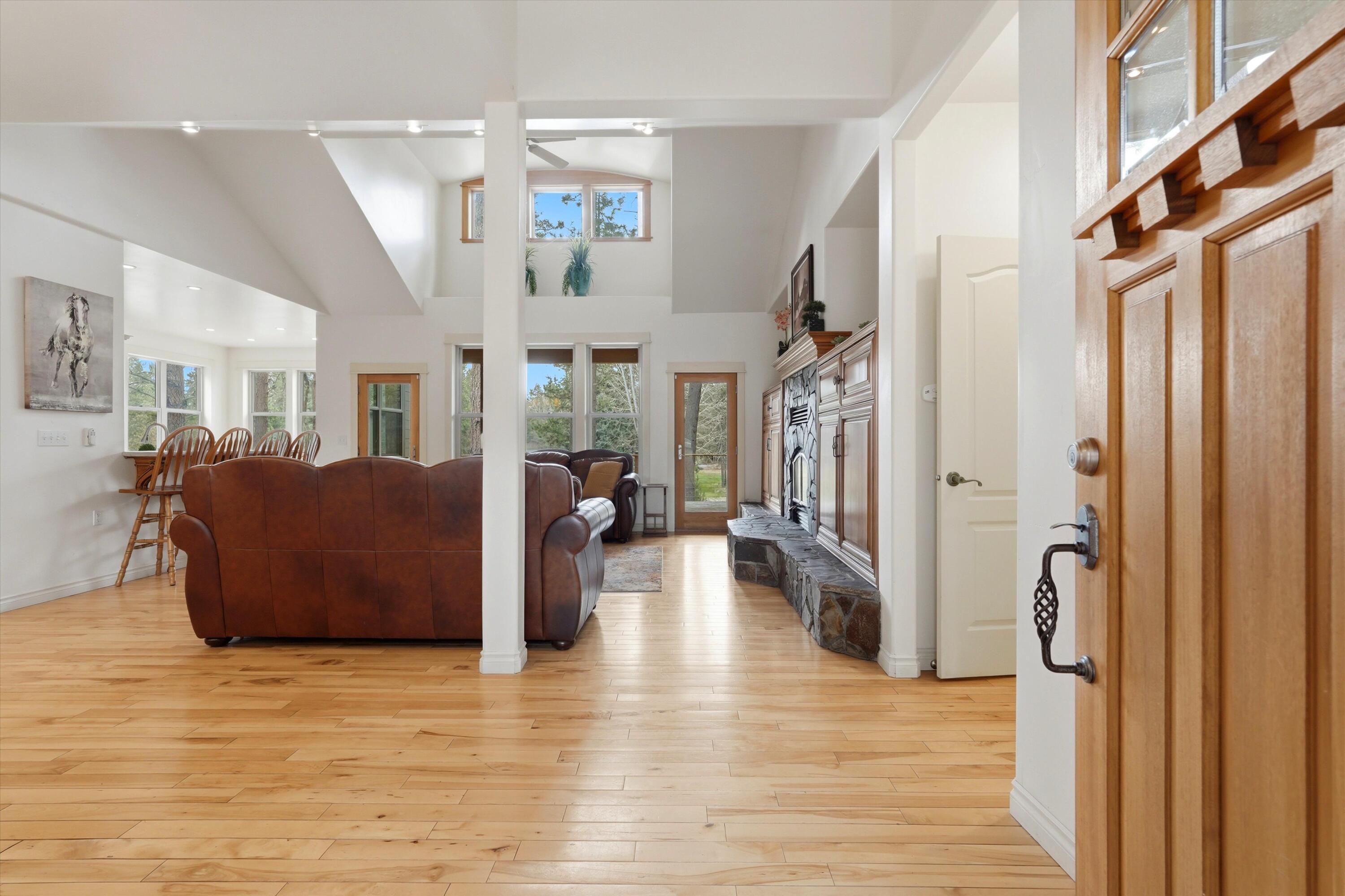 17179 Island Loop Way Bend, OR 97707 - Photo 6 of 52 a view of living room filled with furniture and wooden floor