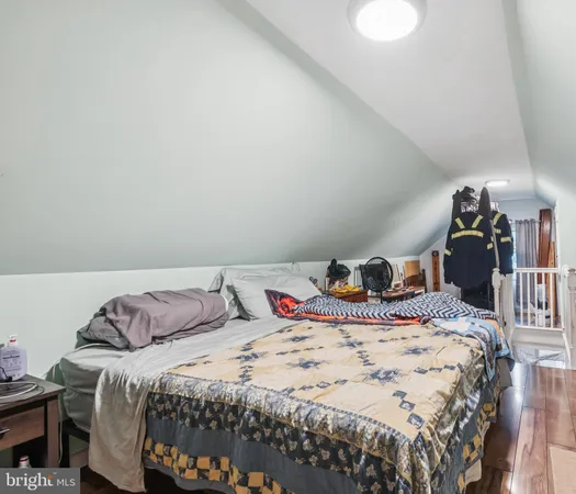 a bedroom with a bed and dresser