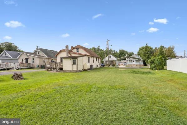 a view of a house with a big yard