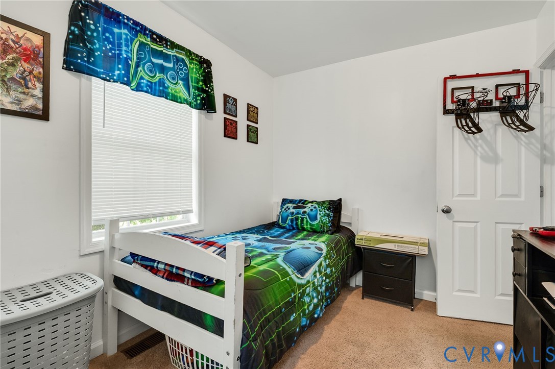2909 Springview Drive Richmond, VA 23234 - Photo 17 of 19 a bedroom with a bed and a window