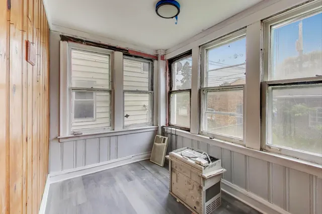 a living room with furniture and windows