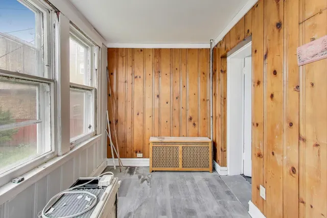 a view of front door with wooden floor