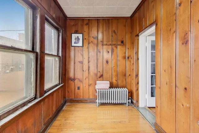 a view of a room with wooden floor and stairs