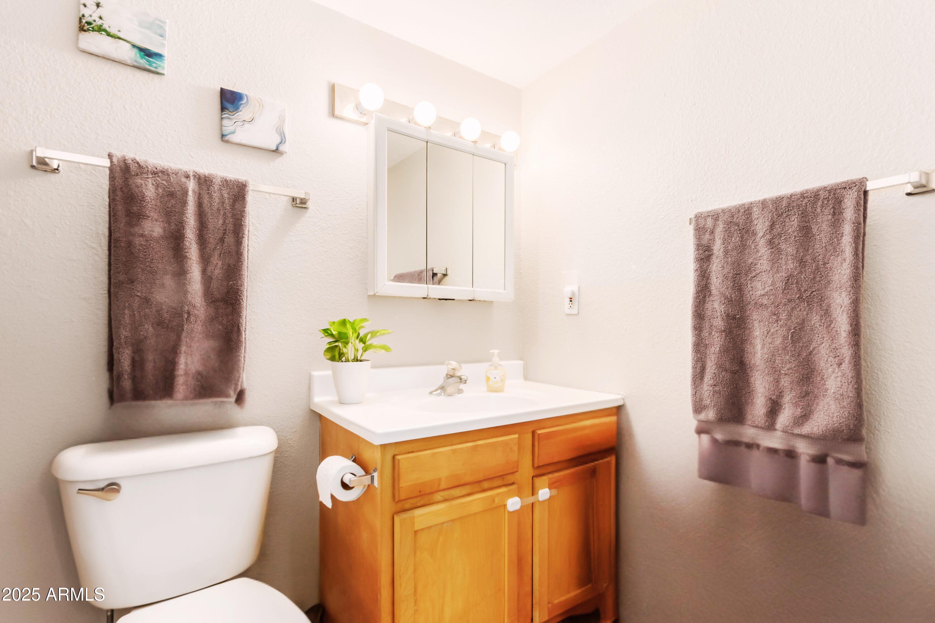 1130 East Butler Drive, Unit A1 Phoenix, AZ 85020 - Photo 11 of 31 a bathroom with a sink a toilet and shower