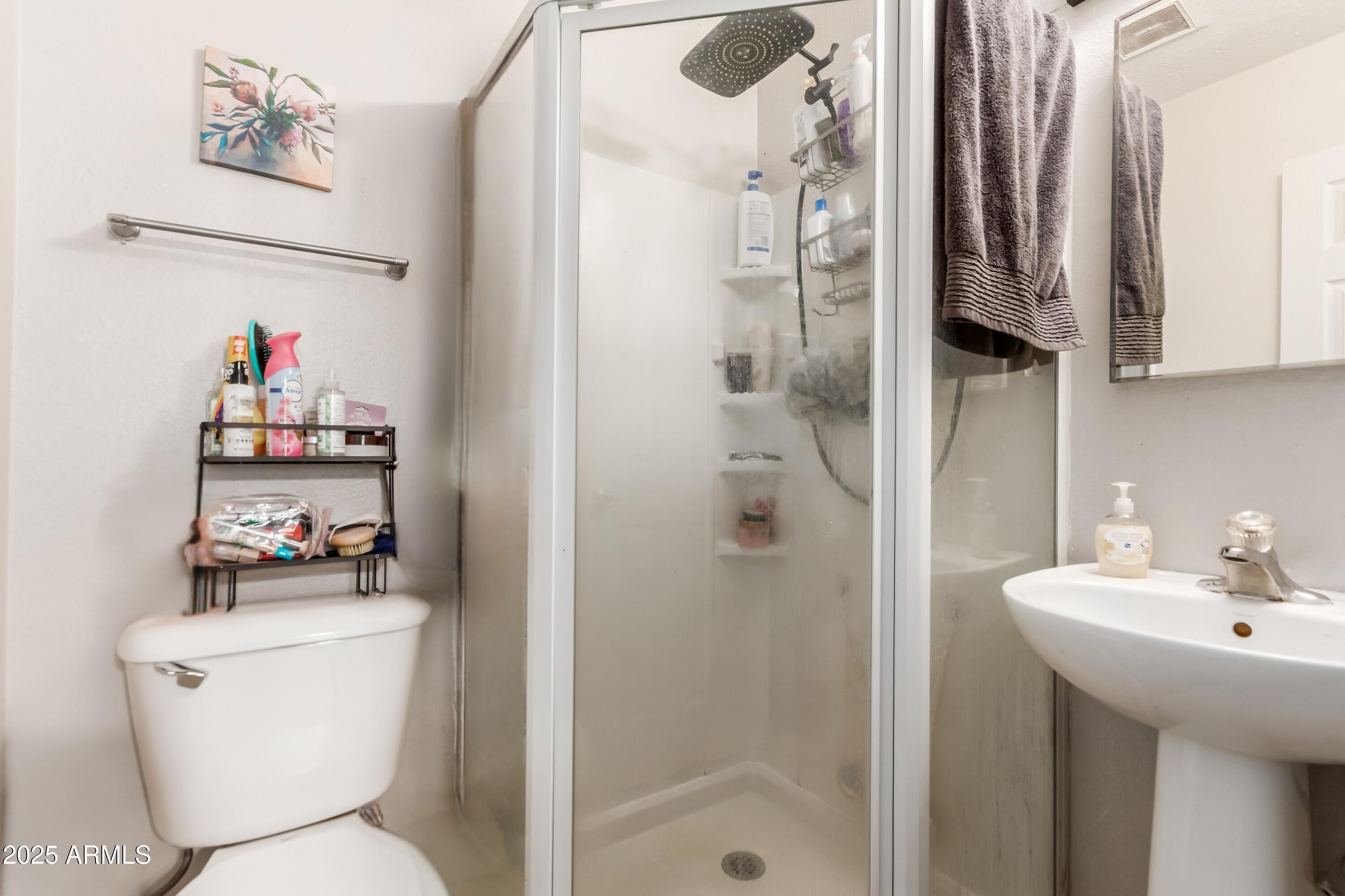 1130 East Butler Drive, Unit A1 Phoenix, AZ 85020 - Photo 14 of 31 a bathroom with a toilet sink and shower