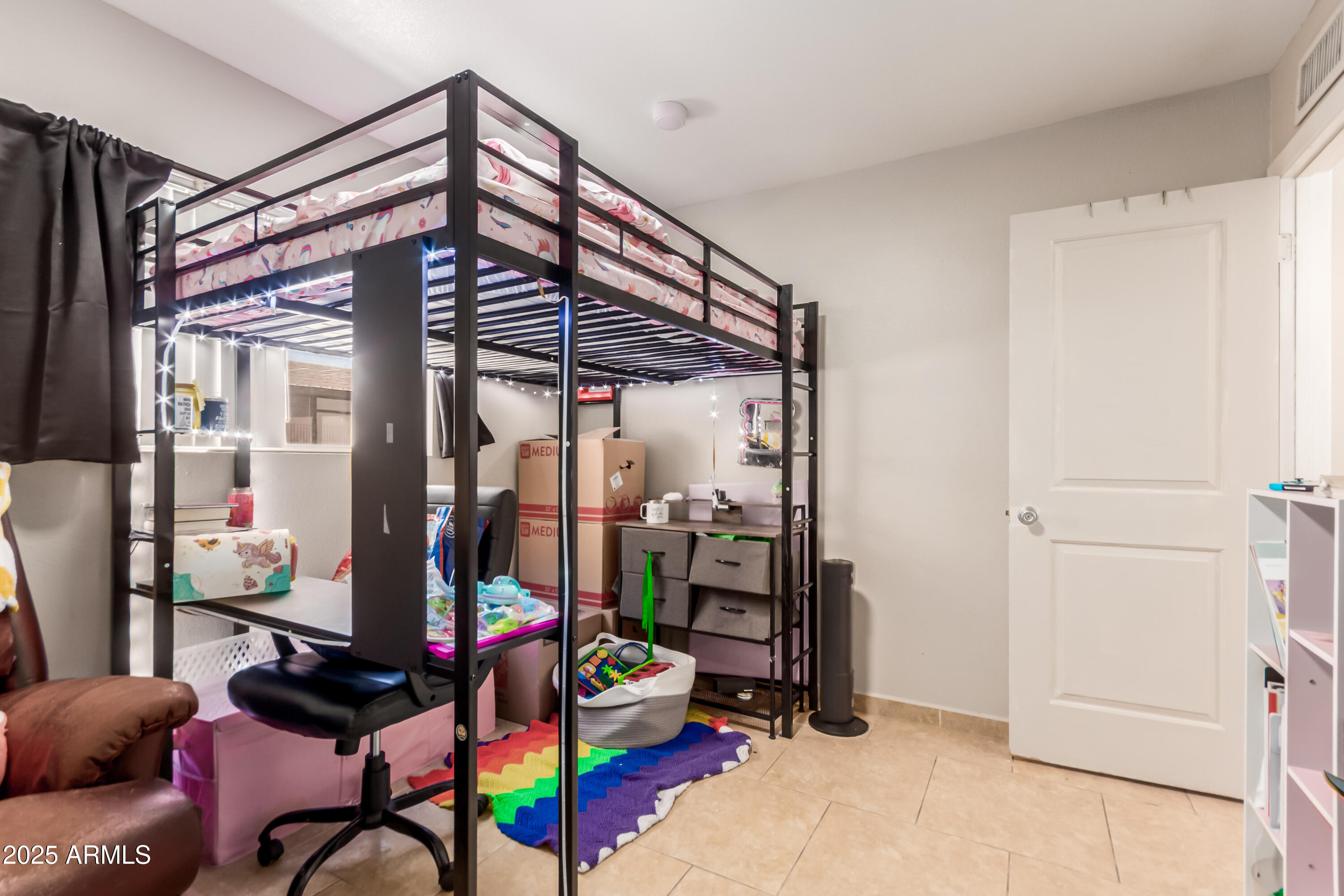 1130 East Butler Drive, Unit A1 Phoenix, AZ 85020 - Photo 17 of 31 a view of a room with toys and furniture
