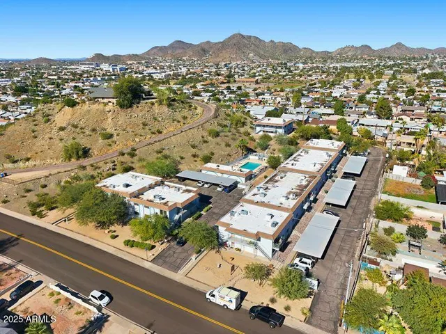 an aerial view of residential houses with outdoor space
