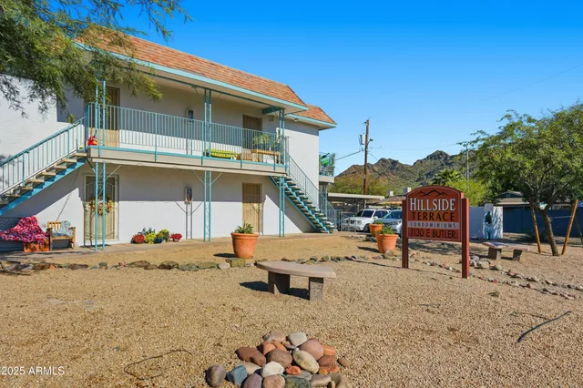 a blue bench sitting in front of a house
