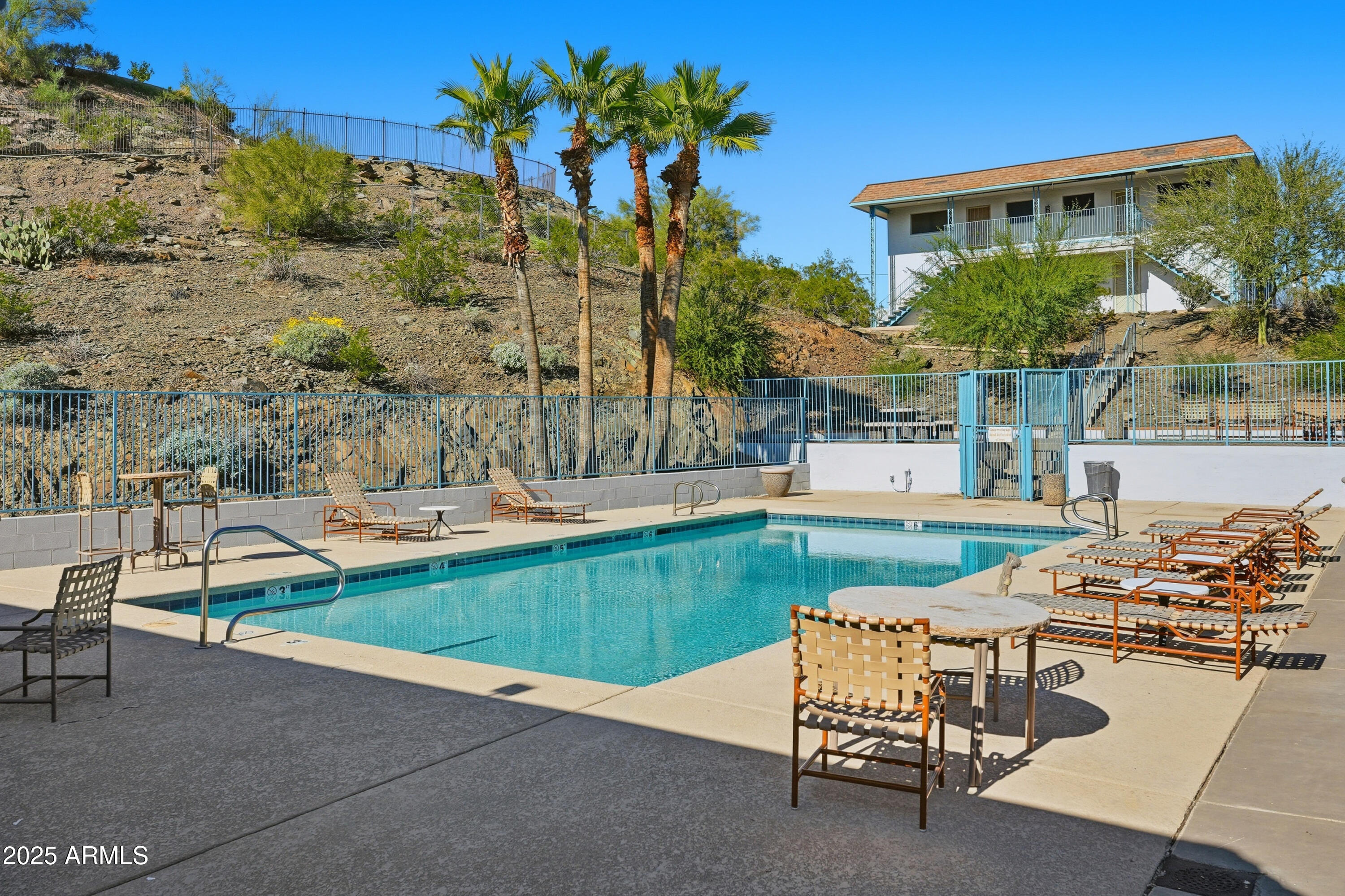 1130 East Butler Drive, Unit A1 Phoenix, AZ 85020 - Photo 28 of 31 a view of a house with swimming pool and sitting area