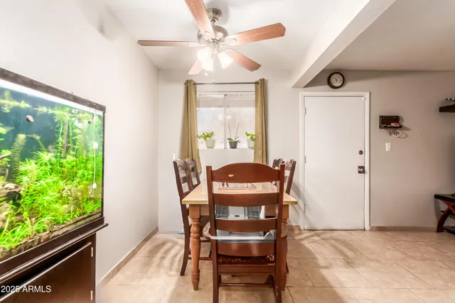 a dining room with furniture and window