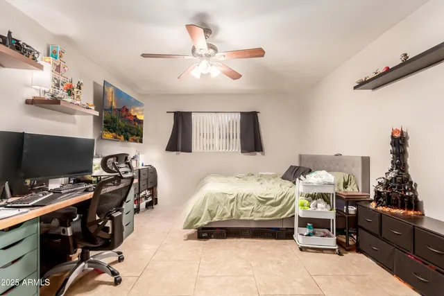 a bedroom with a workspace