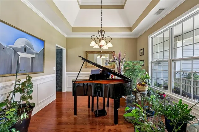 a bathroom with double vanity and a mirror