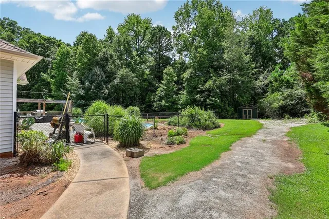 a aerial view of a house with swimming pool and porch