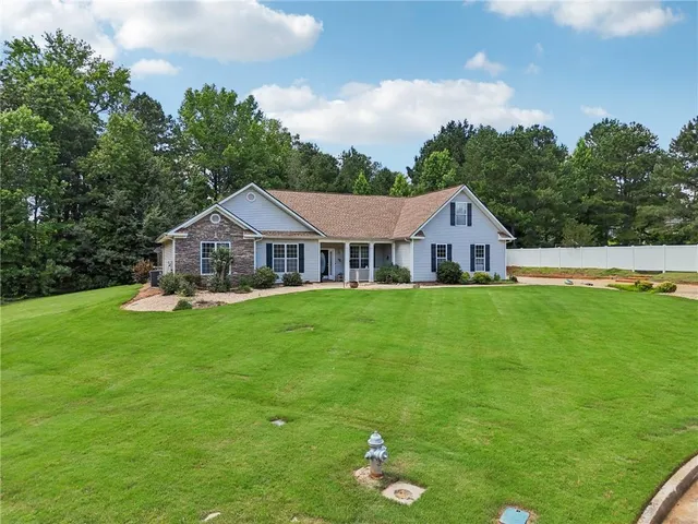 a aerial view of a house with a big yard