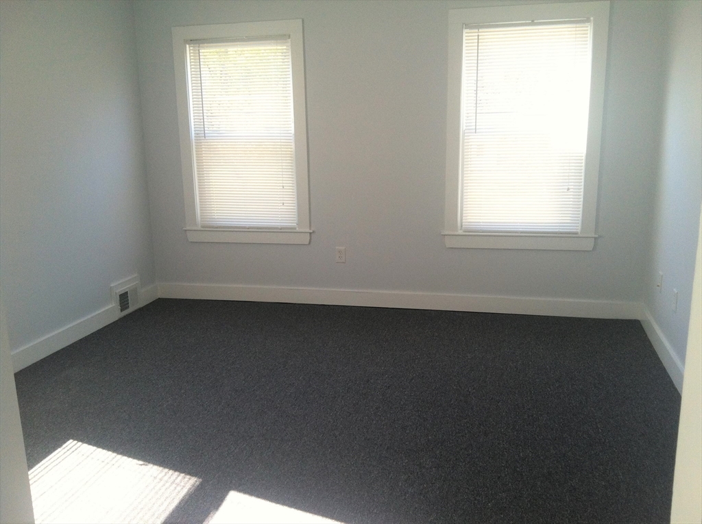 158 Main Street, Unit 2 Wenham, MA 01984 - Photo 12 of 13 an empty room with a window