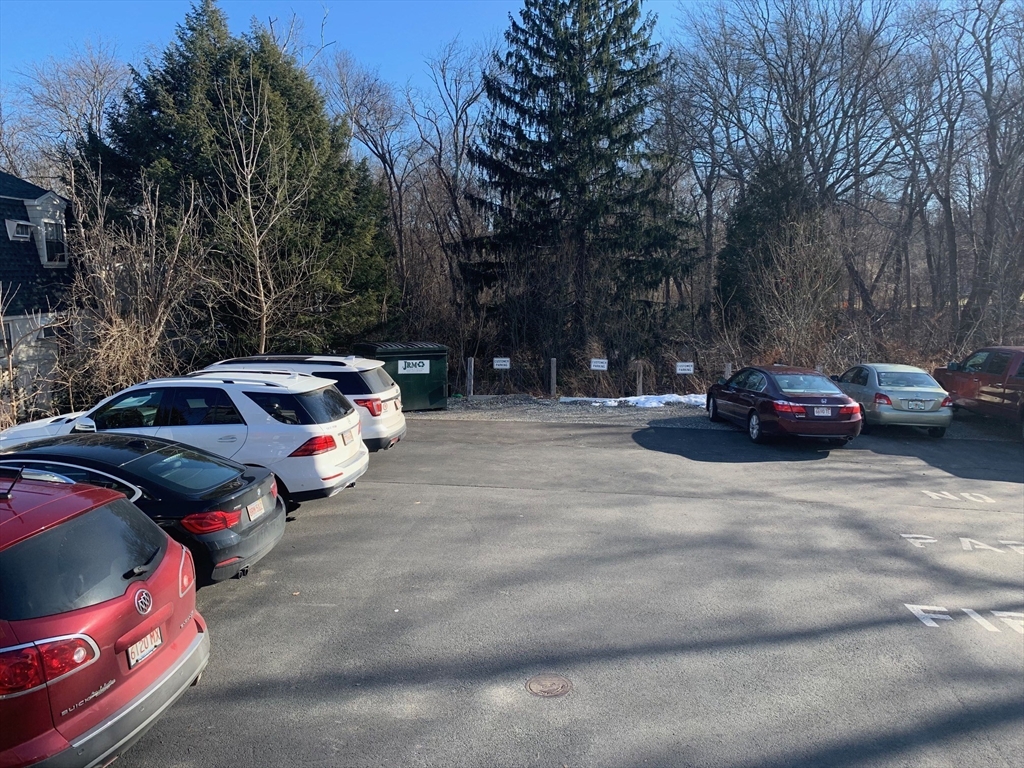 158 Main Street, Unit 2 Wenham, MA 01984 - Photo 13 of 13 a cars parked on the side of a street