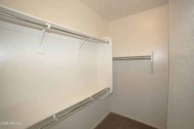 a view of a livingroom with an empty space and a fireplace