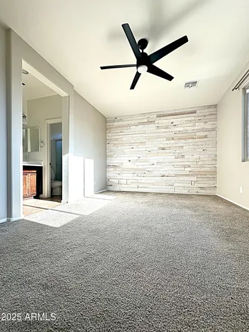 a kitchen with kitchen island granite countertop a sink stove and refrigerator