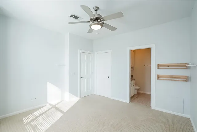 a very nice looking room with a ceiling fan