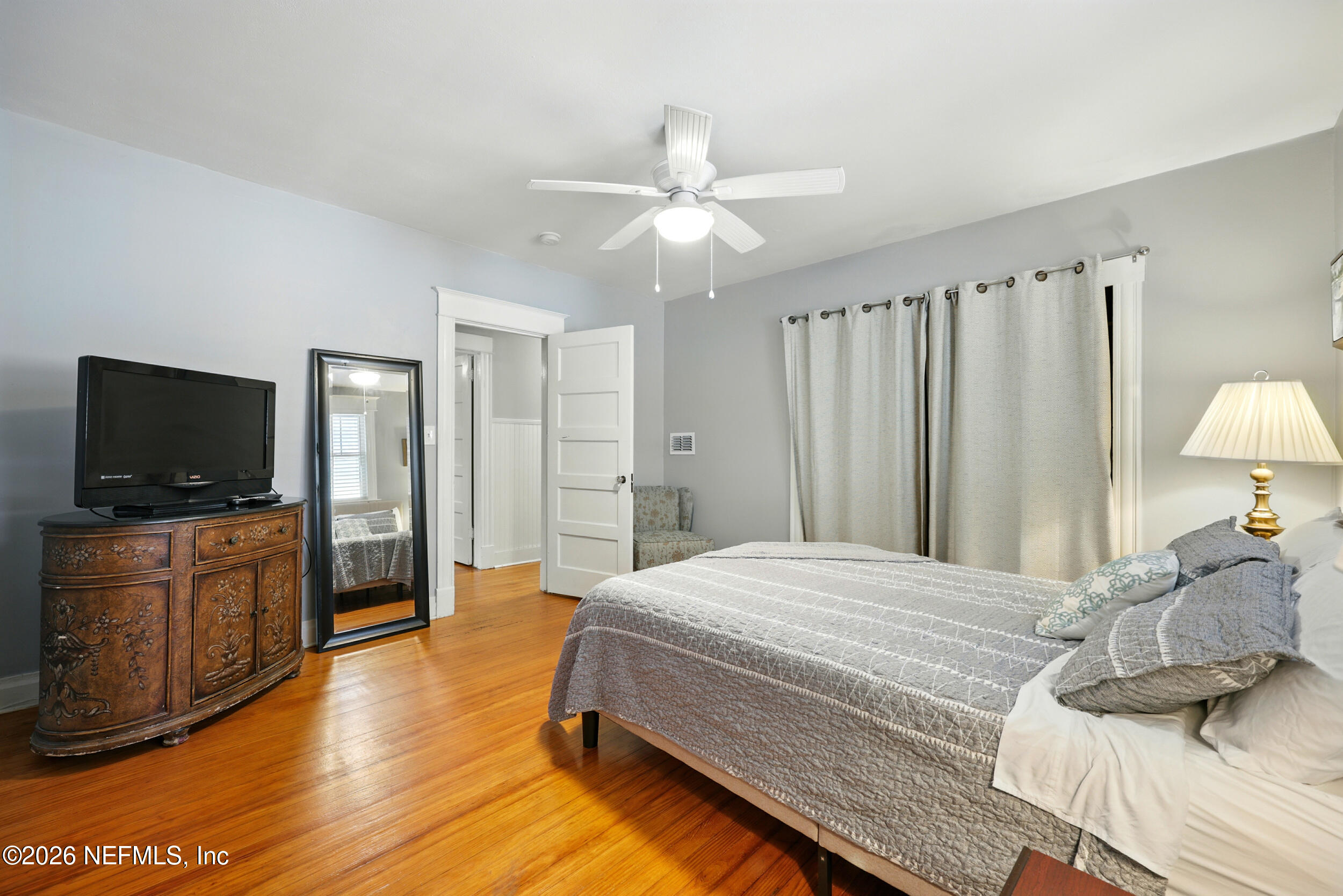 22 Marion Street St. Augustine, FL 32084 - Photo 17 of 23 a bedroom with a bed and a flat screen tv