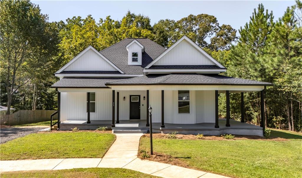 a front view of a house with yard