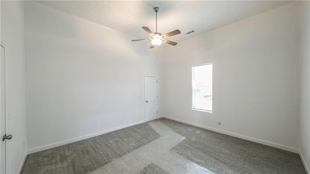 75 Rose Street Tallapoosa, GA 30176 - Photo 15 of 33 an empty room with a window and a fan