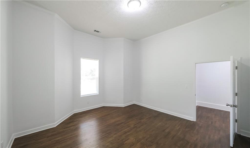 75 Rose Street Tallapoosa, GA 30176 - Photo 20 of 33 an empty room with wooden floor and window