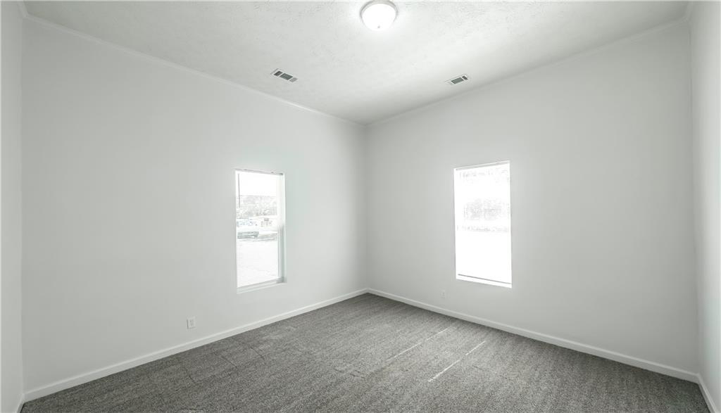 75 Rose Street Tallapoosa, GA 30176 - Photo 25 of 33 an empty room with windows