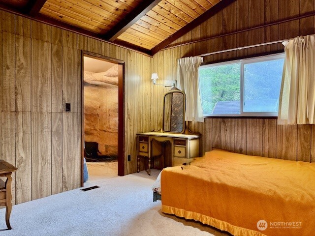 2002 200th Lane Ocean Park, WA 98640 - Photo 16 of 22 a bedroom with a bed table and window