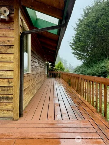 a view of balcony with wooden floor