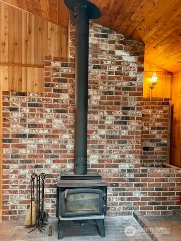 a kitchen with kitchen island granite countertop a sink cabinets stainless steel appliances and a counter top space