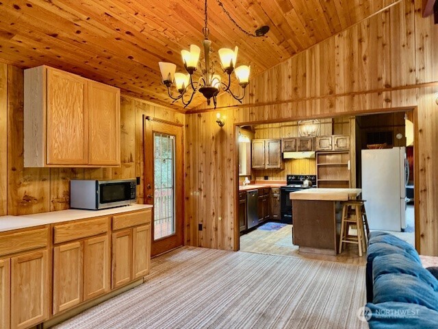 2002 200th Lane Ocean Park, WA 98640 - Photo 10 of 22 a kitchen with kitchen island granite countertop a sink cabinets stainless steel appliances and a counter top space