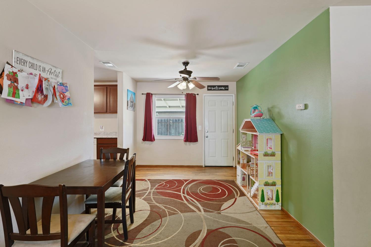 152 Drake Avenue Modesto, CA 95350 - Photo 15 of 52 a view of a dining room with furniture and chandelier