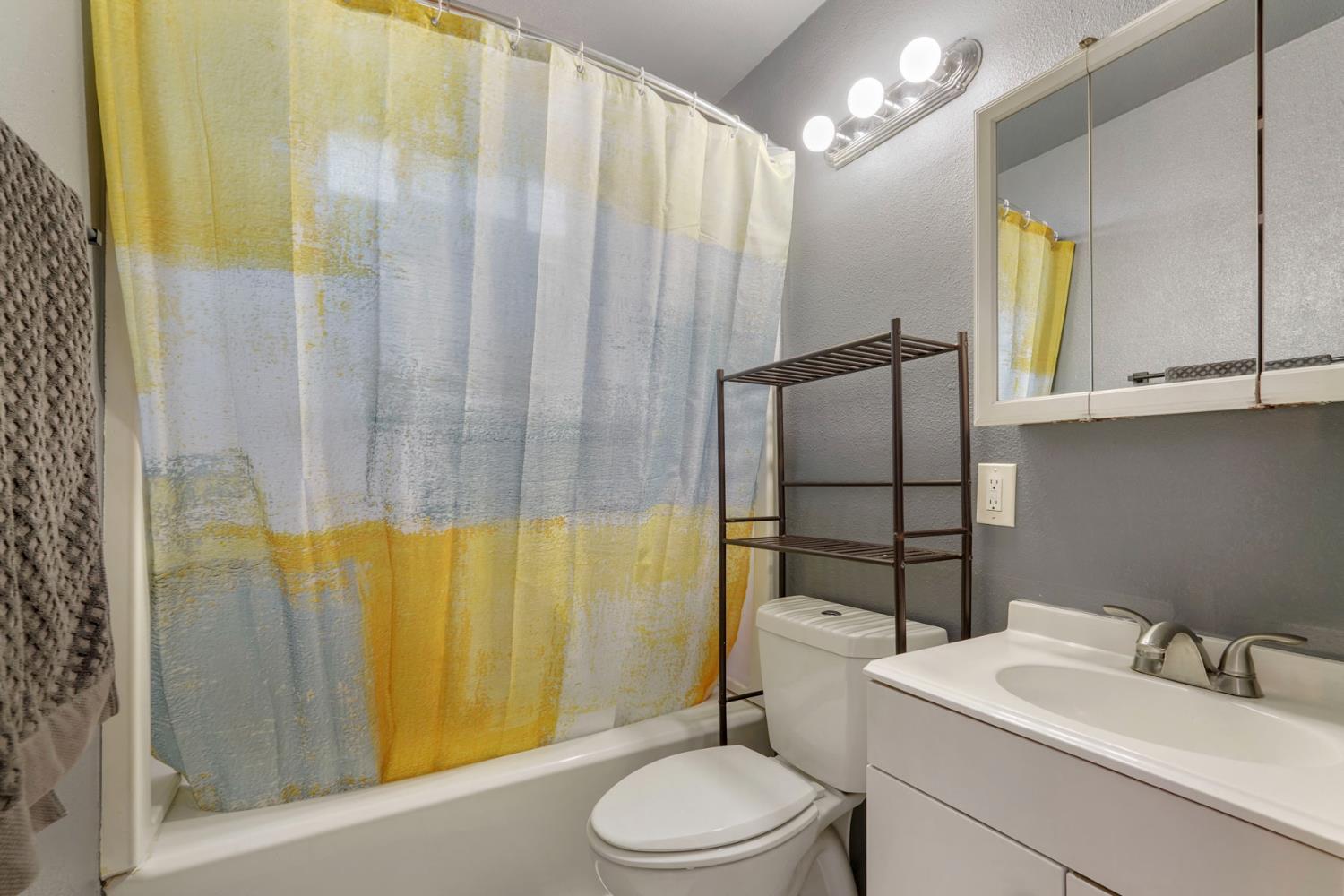 152 Drake Avenue Modesto, CA 95350 - Photo 19 of 52 a bathroom with a sink toilet and shower