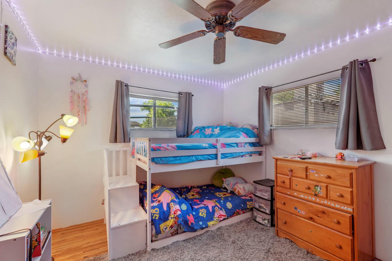 152 Drake Avenue Modesto, CA 95350 - Photo 20 of 52 a room with wooden furniture and windows