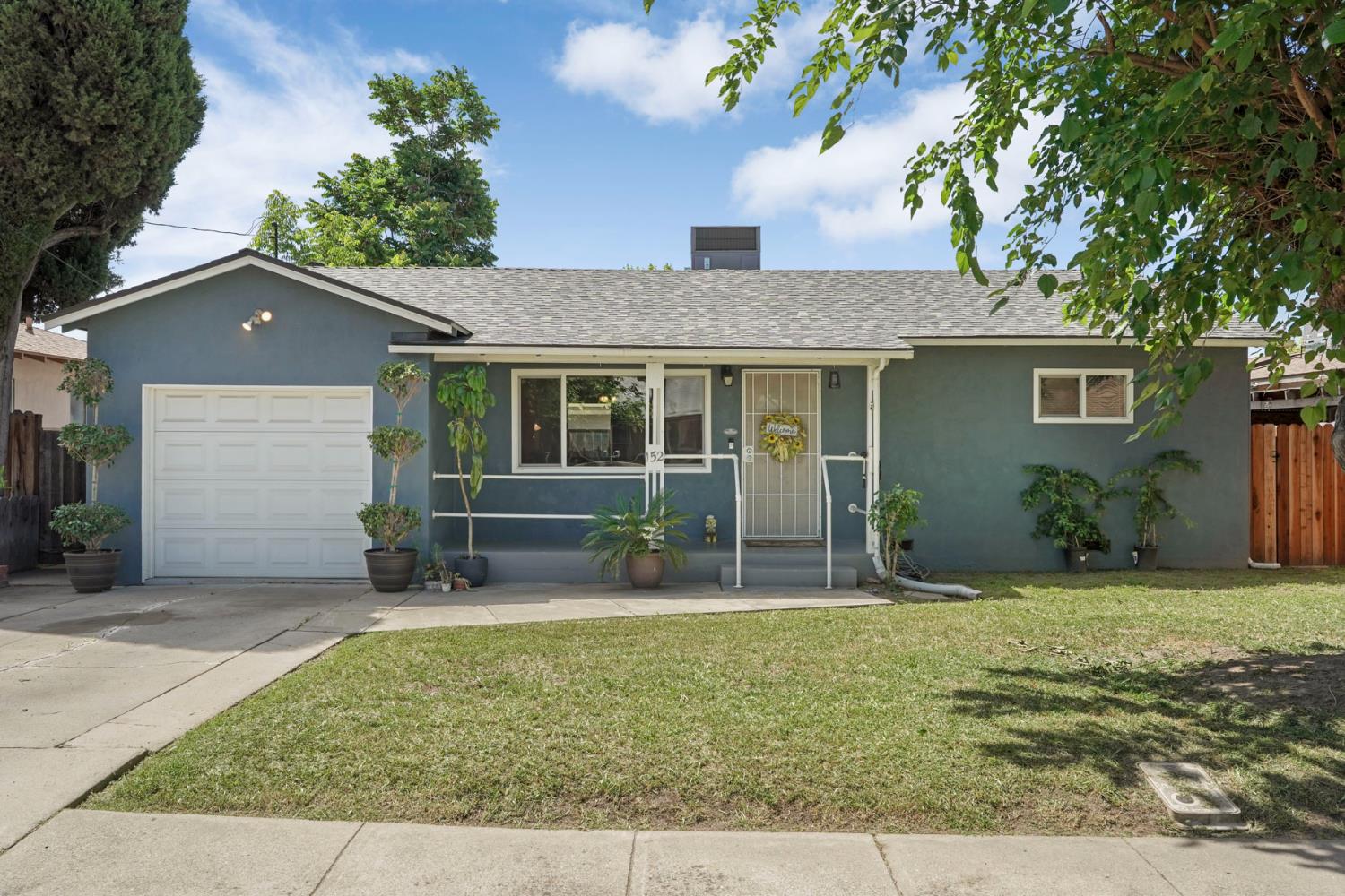 152 Drake Avenue Modesto, CA 95350 - Photo 2 of 52 front view of a house with a yard