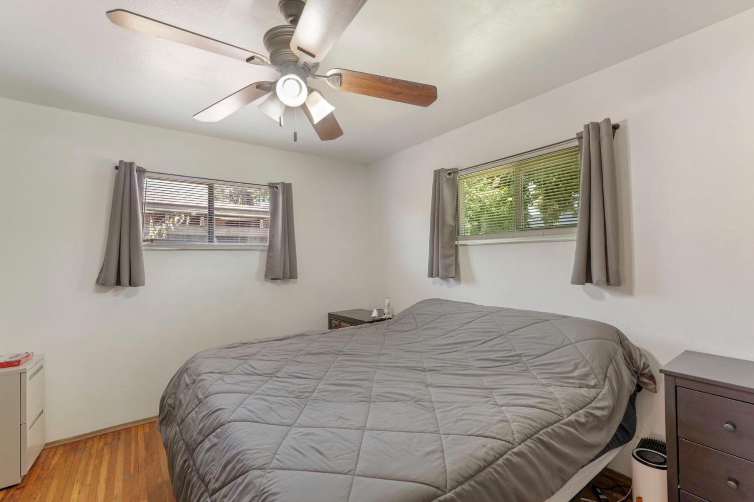 152 Drake Avenue Modesto, CA 95350 - Photo 22 of 52 a bedroom with a large bed and a window
