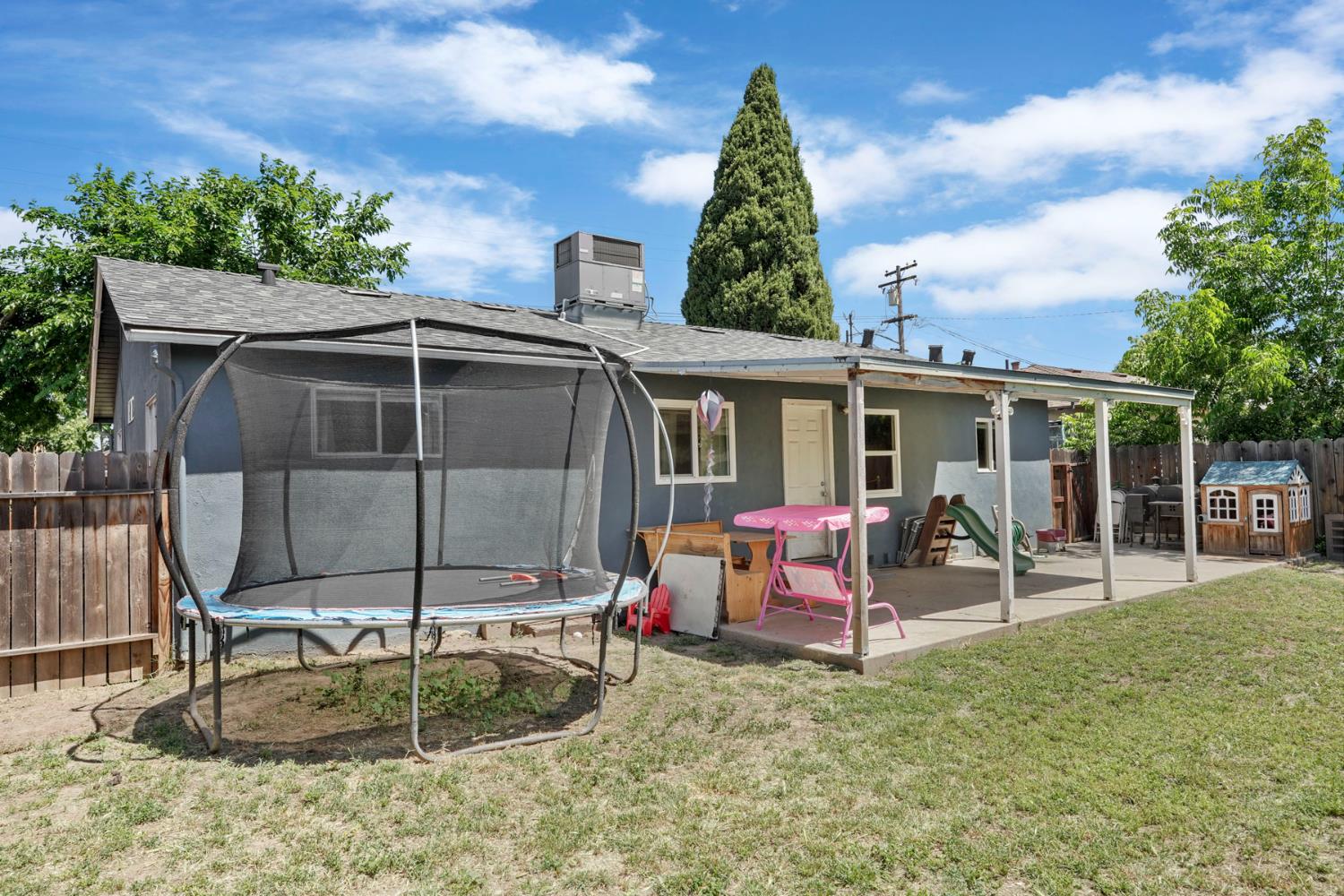 152 Drake Avenue Modesto, CA 95350 - Photo 28 of 52 a view of a house with backyard porch and sitting area