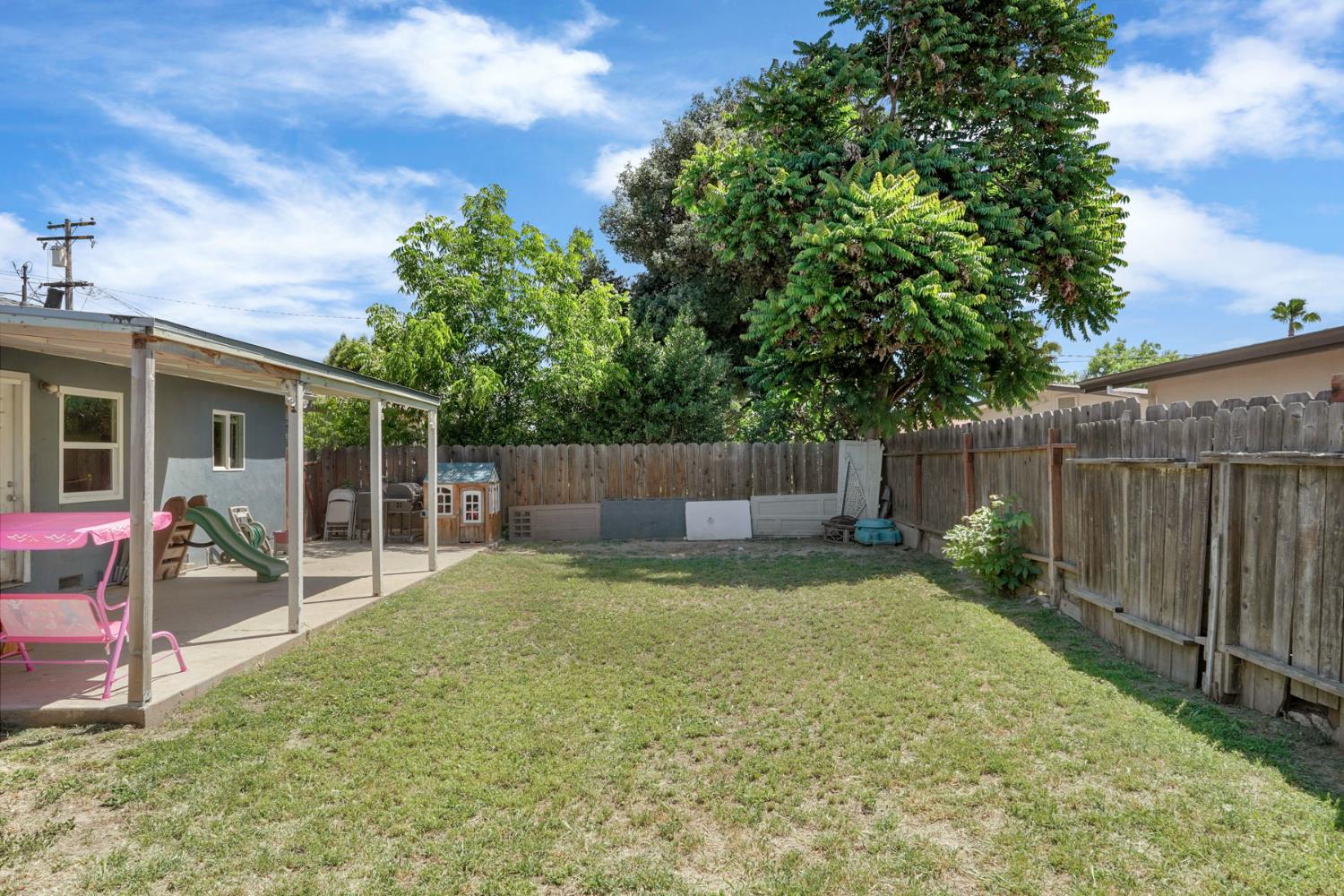 152 Drake Avenue Modesto, CA 95350 - Photo 29 of 52 a backyard of a house with table and chairs
