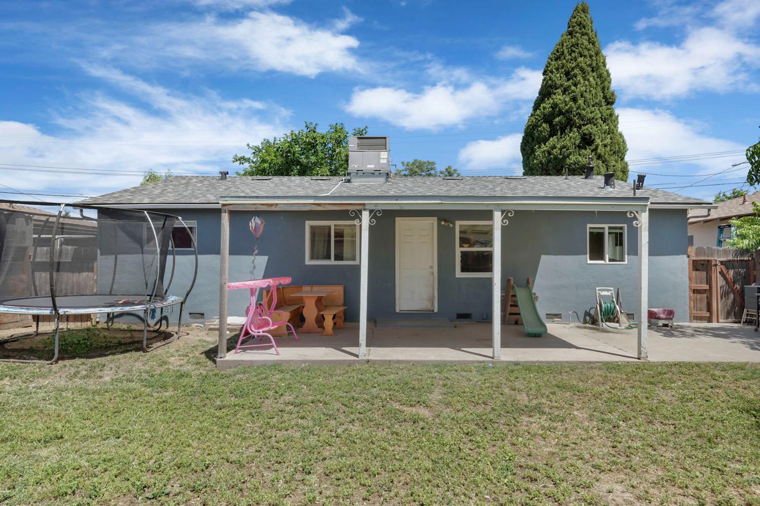 152 Drake Avenue Modesto, CA 95350 - Photo 30 of 52 front view of a house with a yard