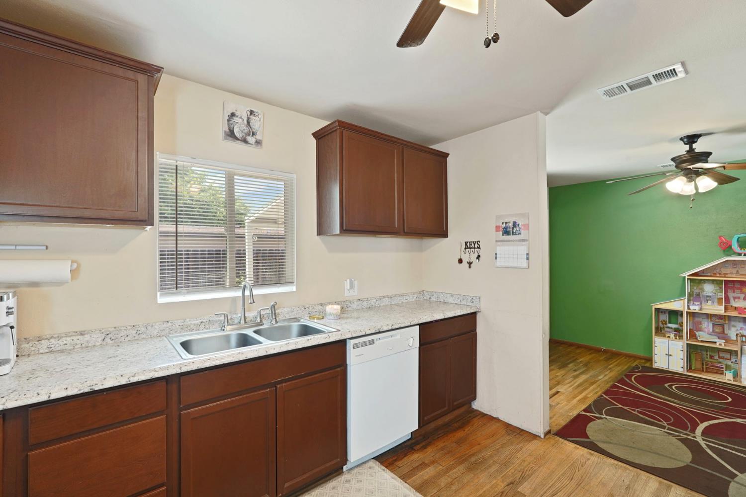 152 Drake Avenue Modesto, CA 95350 - Photo 10 of 52 a kitchen with a sink stove and cabinets