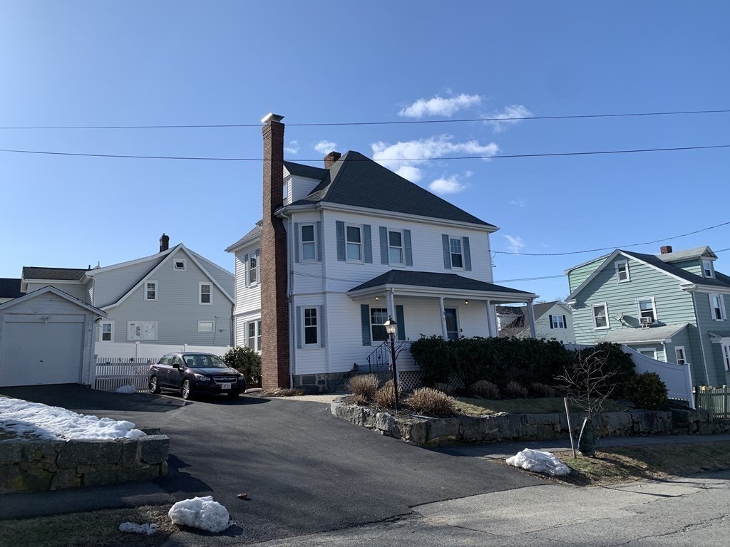 a view of multiple houses with cars