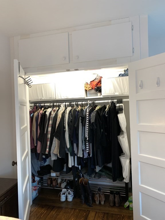 93 Waldeck Road Milton, MA 02186 - Photo 14 of 30 a view of walk in closet with clothes and shoes